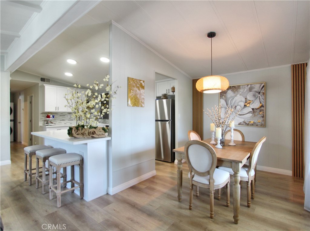 692 North Adele Street, Unit 101 Orange, CA 92867 - Photo 5 of 20 a view of a dining room with furniture window and wooden floor