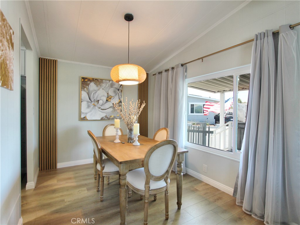 692 North Adele Street, Unit 101 Orange, CA 92867 - Photo 6 of 20 a view of a dining room with furniture window and wooden floor