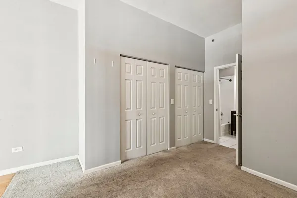 a bathroom with a toilet a sink and a mirror