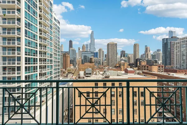 a view of balcony with a floor to ceiling window