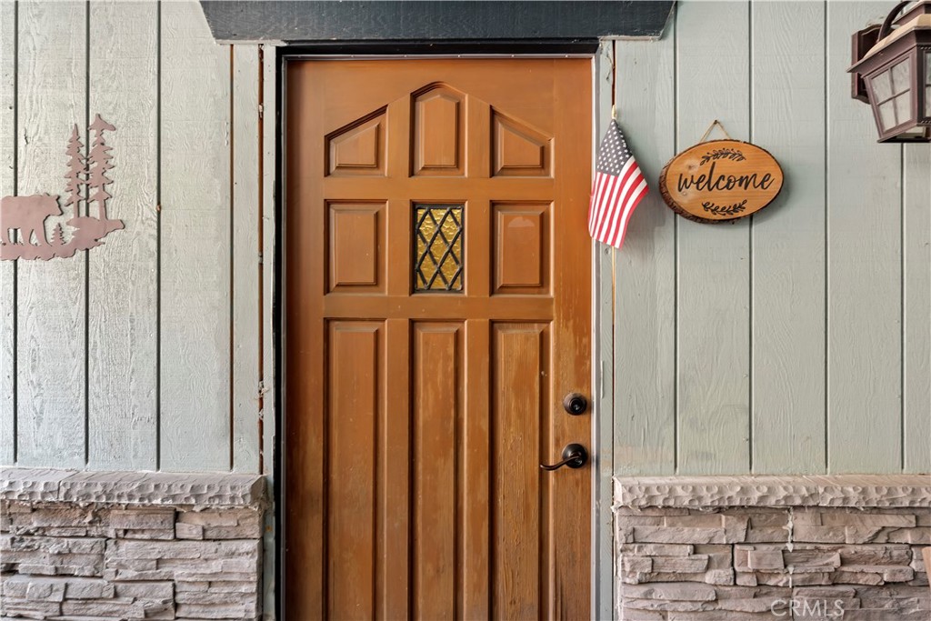 615 Wellesley Lake Arrowhead, CA 92352 - Photo 1 of 45 a view of a door with wooden door