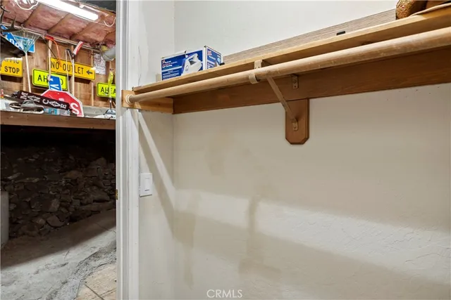 a wooden bench sitting in front of a building