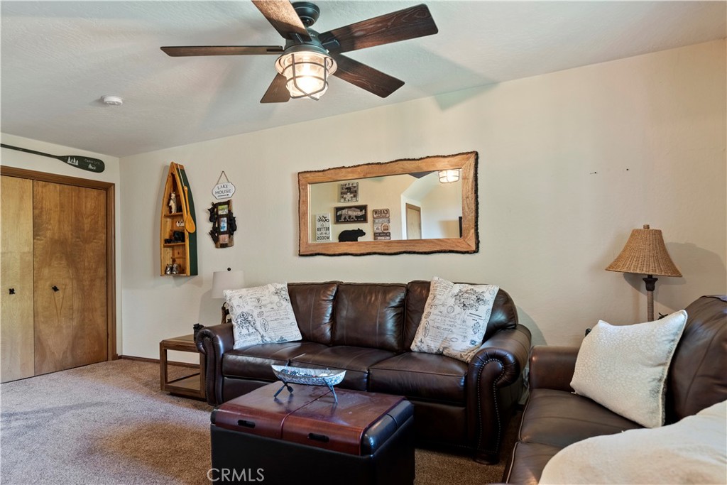 615 Wellesley Lake Arrowhead, CA 92352 - Photo 22 of 45 a living room with furniture and a ceiling fan