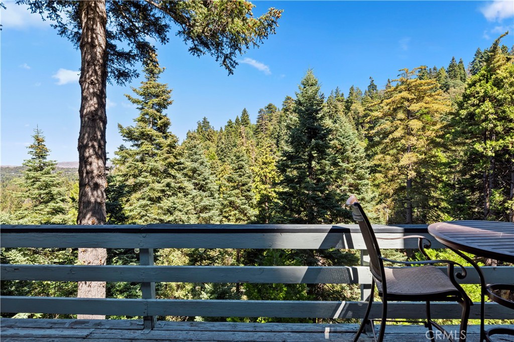 615 Wellesley Lake Arrowhead, CA 92352 - Photo 29 of 45 a wooden bench sitting in front of a building