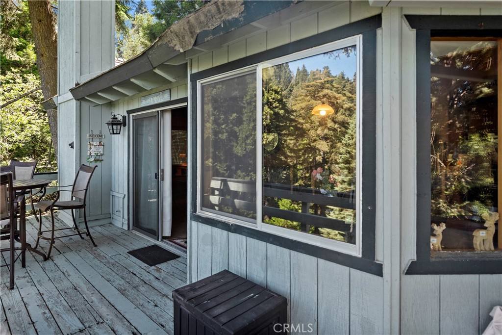 615 Wellesley Lake Arrowhead, CA 92352 - Photo 35 of 45 a view of a balcony with chairs and wooden floor