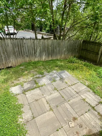 a backyard of a house with lots of green space