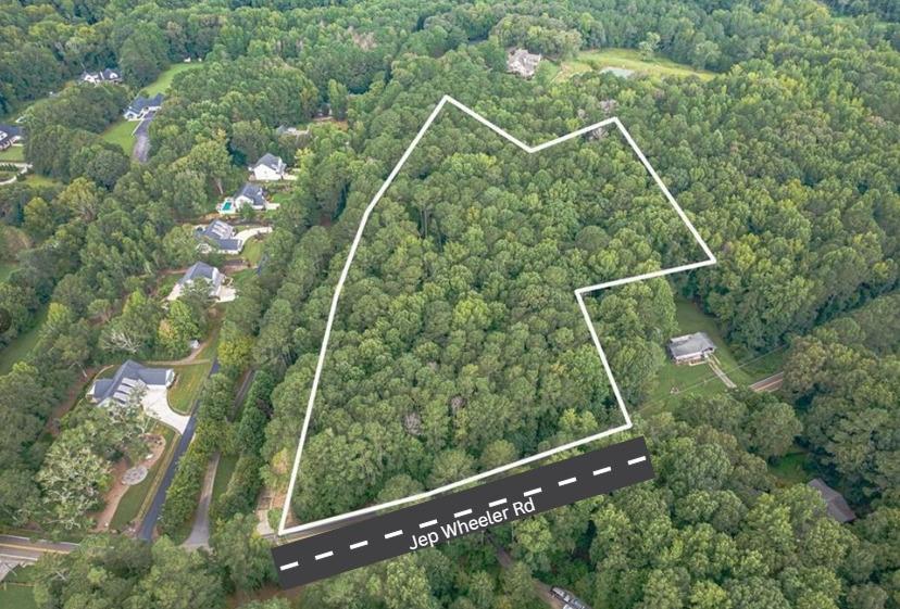 0 Jep Wheeler Road Woodstock, GA 30188 - Photo 1 of 2 a view of a yard and basketball court