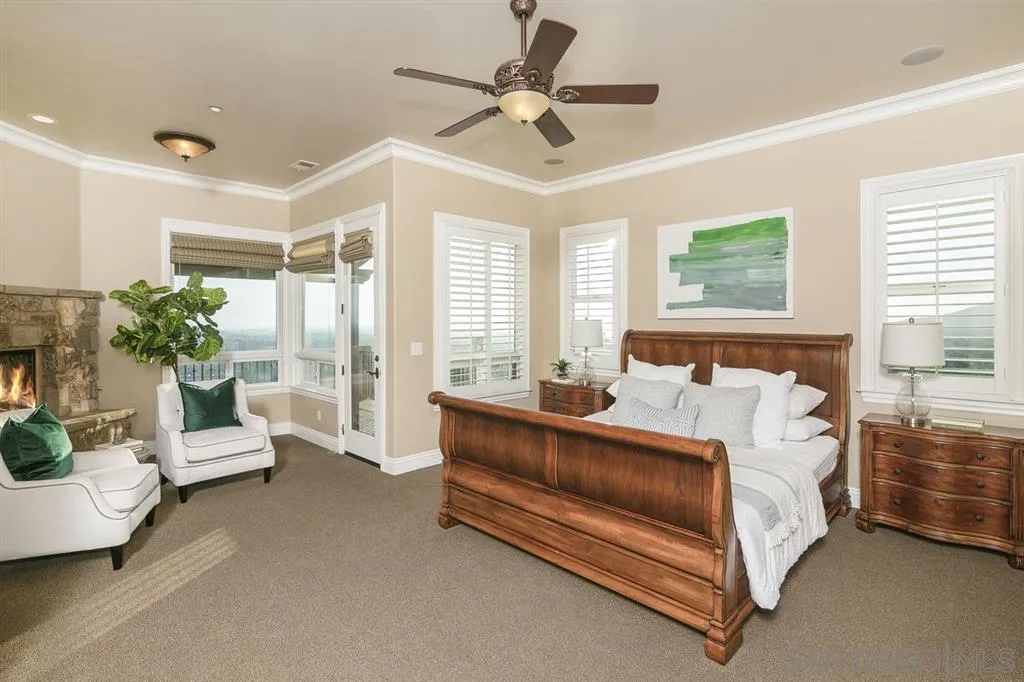 9443 Sunset Avenue La Mesa, CA 91941 - Photo 13 of 25 a spacious bedroom with a bed and a couch