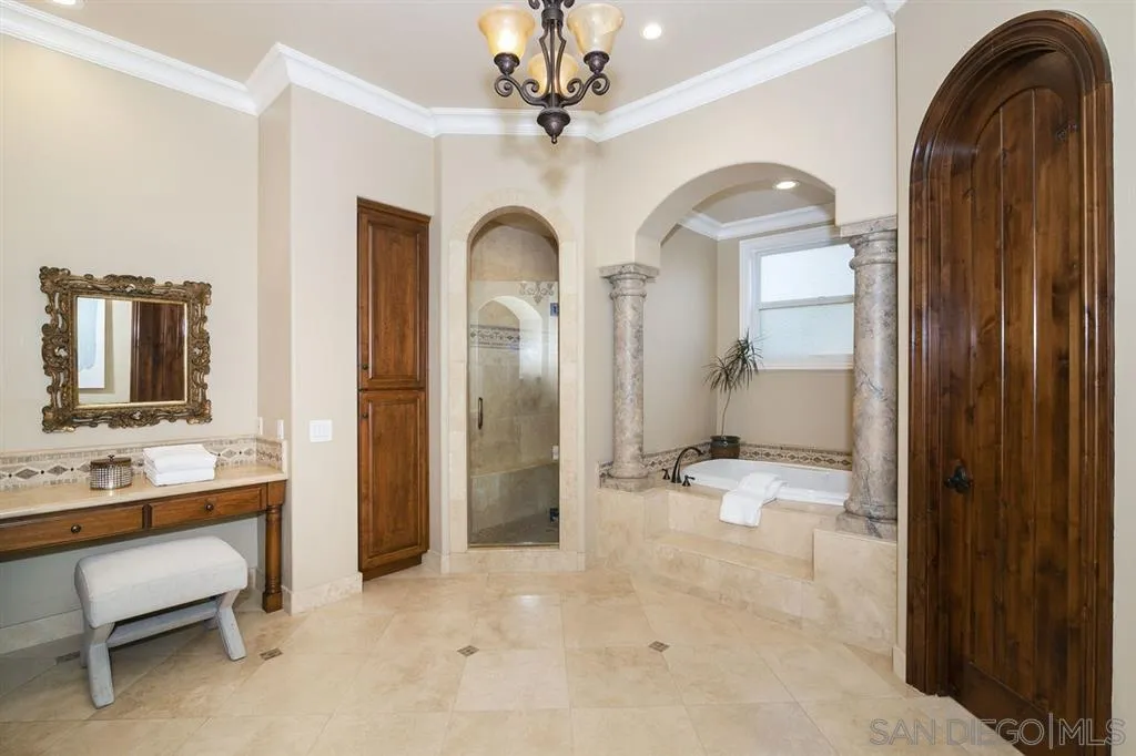 9443 Sunset Avenue La Mesa, CA 91941 - Photo 15 of 25 a spacious bathroom with a double vanity sink and a mirror