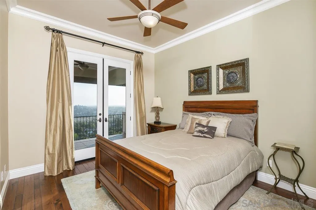 9443 Sunset Avenue La Mesa, CA 91941 - Photo 17 of 25 a bedroom with a bed and wooden floor