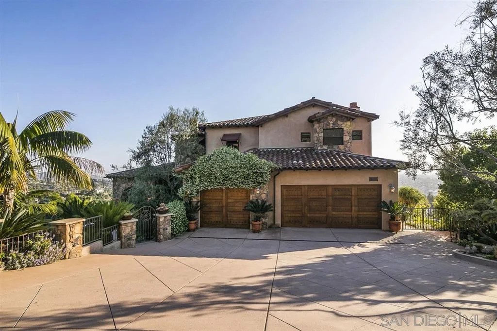 9443 Sunset Avenue La Mesa, CA 91941 - Photo 21 of 25 a front view of a house with a yard and garage