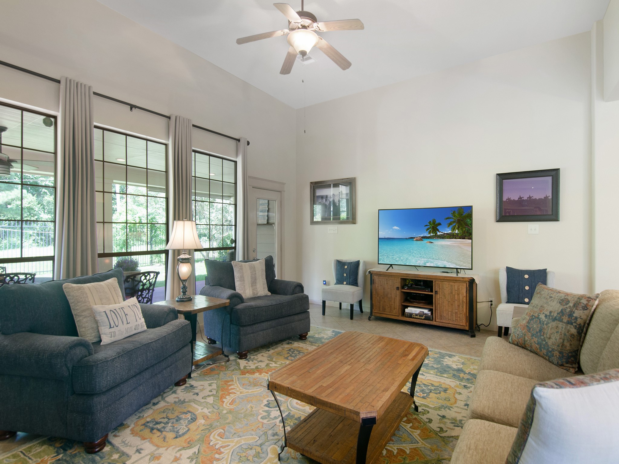 28323 Ryans Ridge Lane Spring, TX 77386 - Photo 24 of 45 Wall of windows frames peaceful backyard views and covered patio access.
