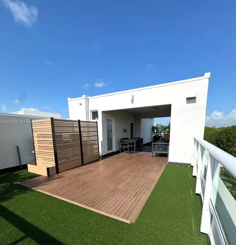 a front view of a house with yard and porch