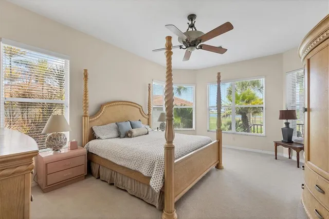 a bed room with a bed and a large window