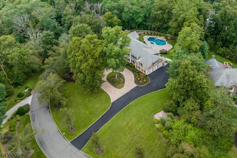 12 Oak Hill Road Bernards, NJ 07920 - Photo 33 of 33 an aerial view of a house with a yard and trees