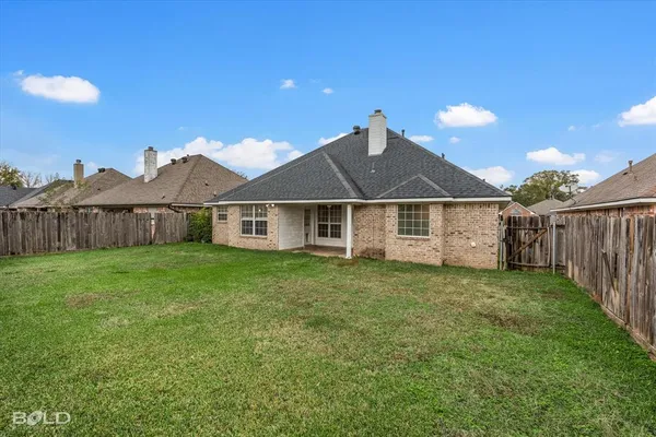 a front view of a house with yard