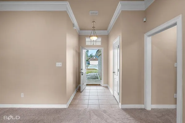 a view of an empty room with a fireplace