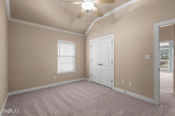 a kitchen with cabinets appliances a sink and a window