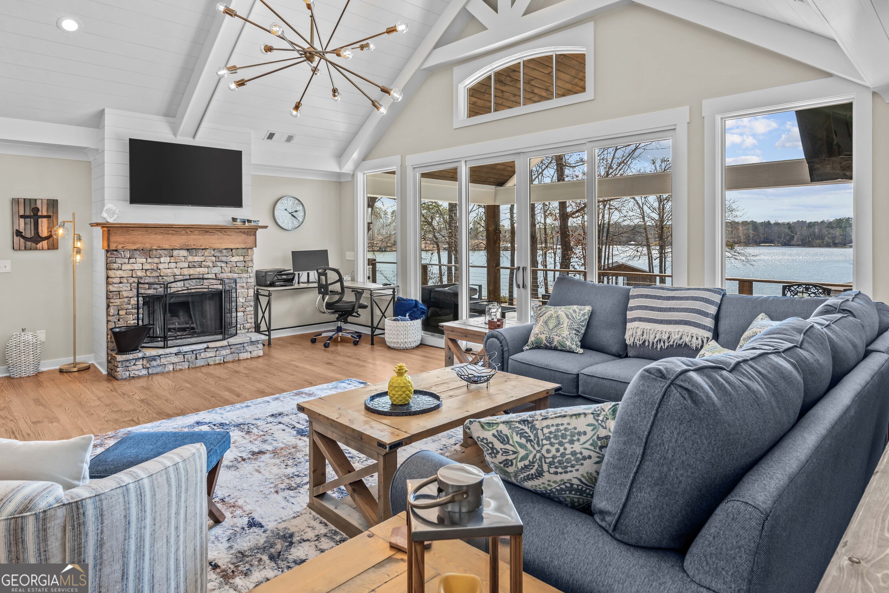 766 South Steel Bridge Road Eatonton, GA 31024 - Photo 11 of 71 a living room with furniture fireplace and a flat screen tv