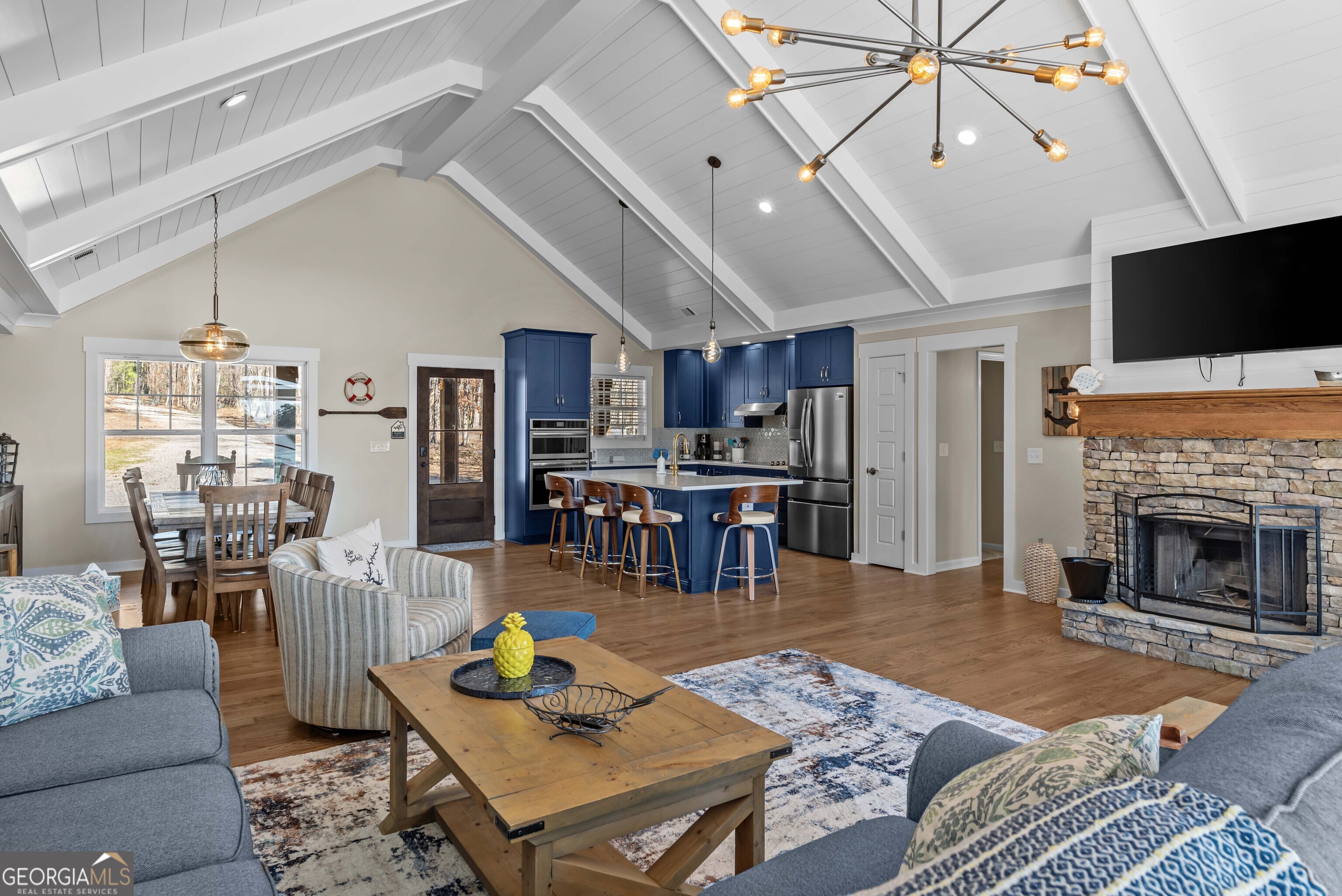 766 South Steel Bridge Road Eatonton, GA 31024 - Photo 14 of 71 a living room with furniture and a fireplace