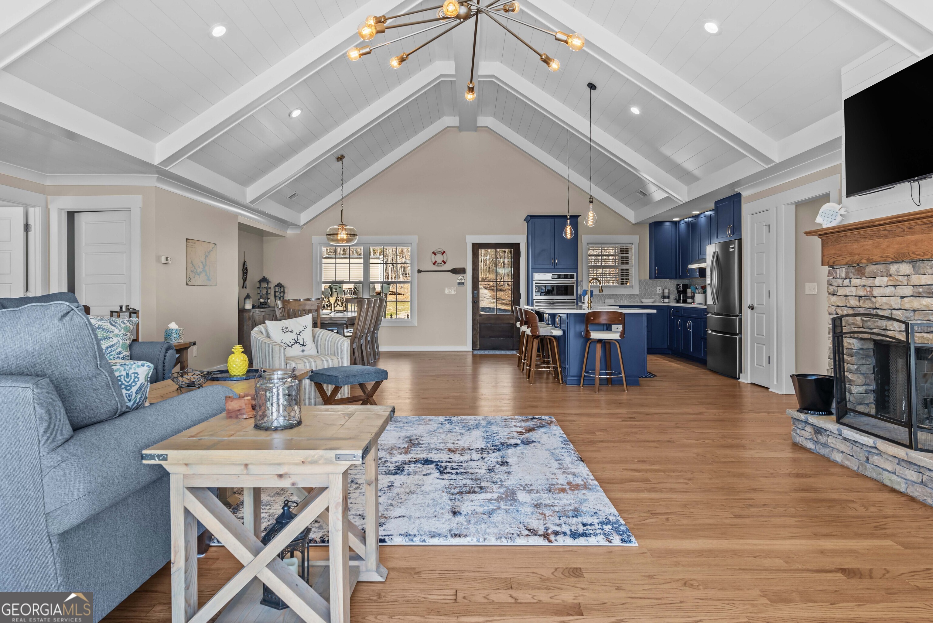 766 South Steel Bridge Road Eatonton, GA 31024 - Photo 15 of 71 a living room with fireplace furniture and a wooden floor