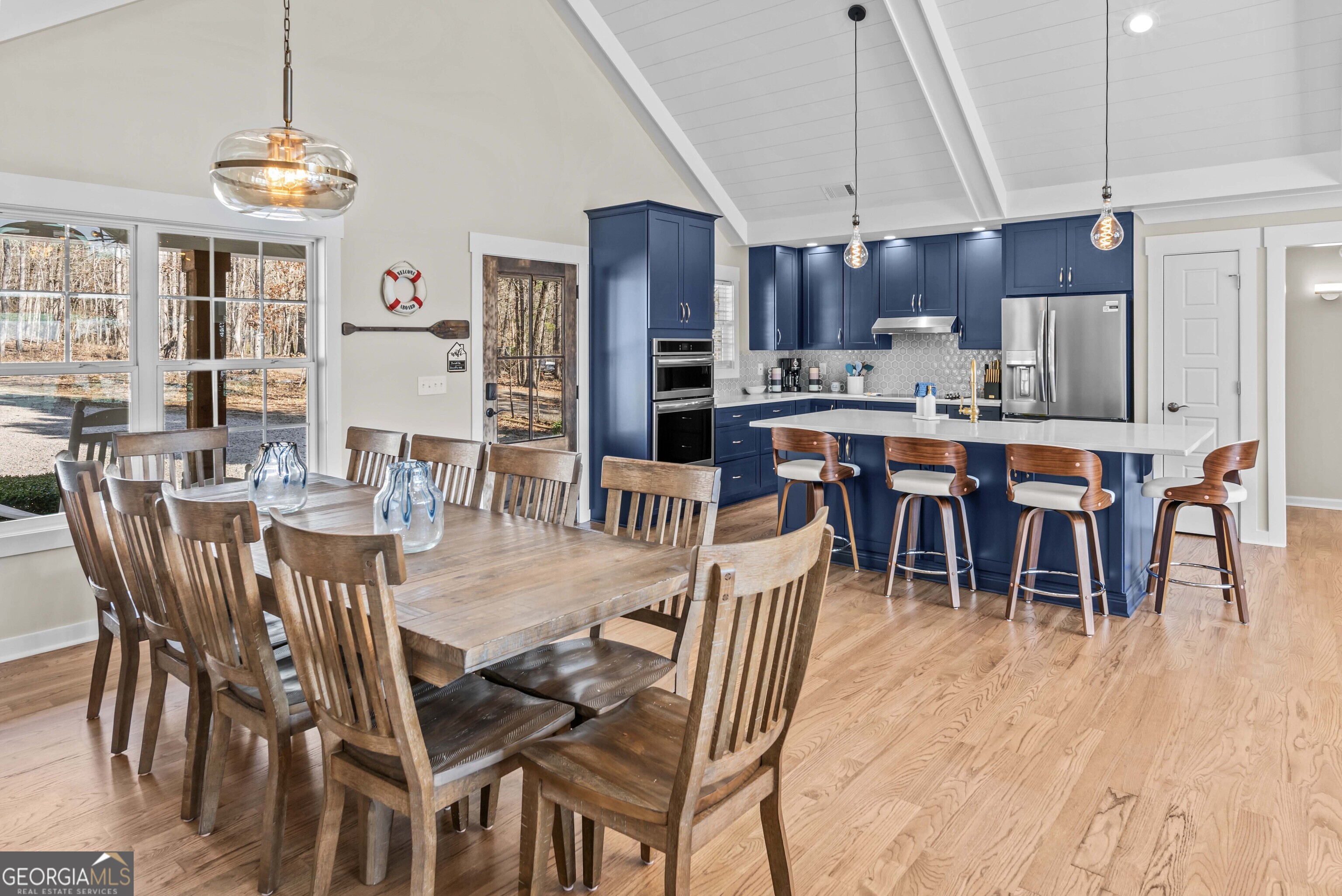 766 South Steel Bridge Road Eatonton, GA 31024 - Photo 17 of 71 a view of a dining room with furniture window and wooden floor