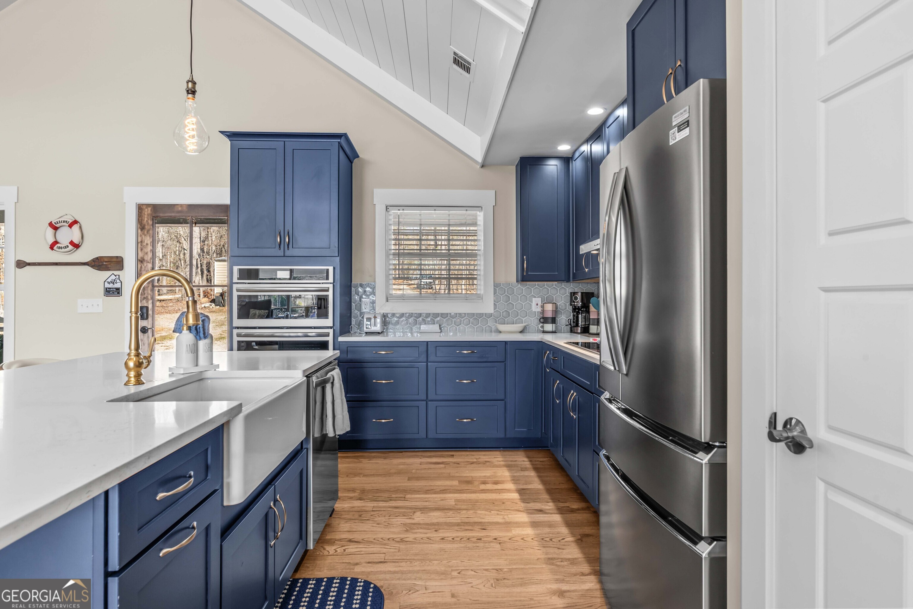 766 South Steel Bridge Road Eatonton, GA 31024 - Photo 24 of 71 a kitchen with stainless steel appliances granite countertop a refrigerator and a stove top oven