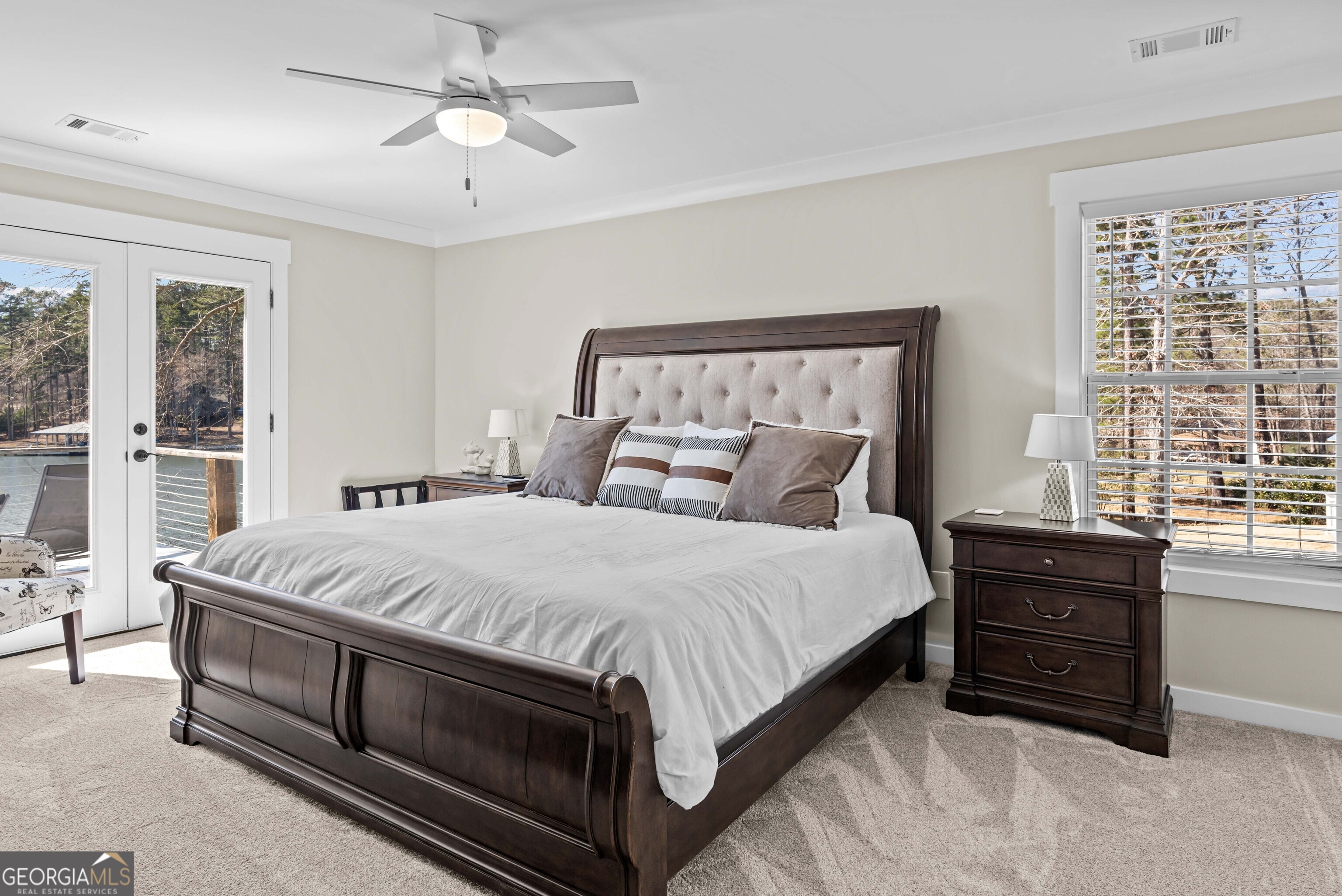 766 South Steel Bridge Road Eatonton, GA 31024 - Photo 26 of 71 a large bed sitting in a bedroom next to a window