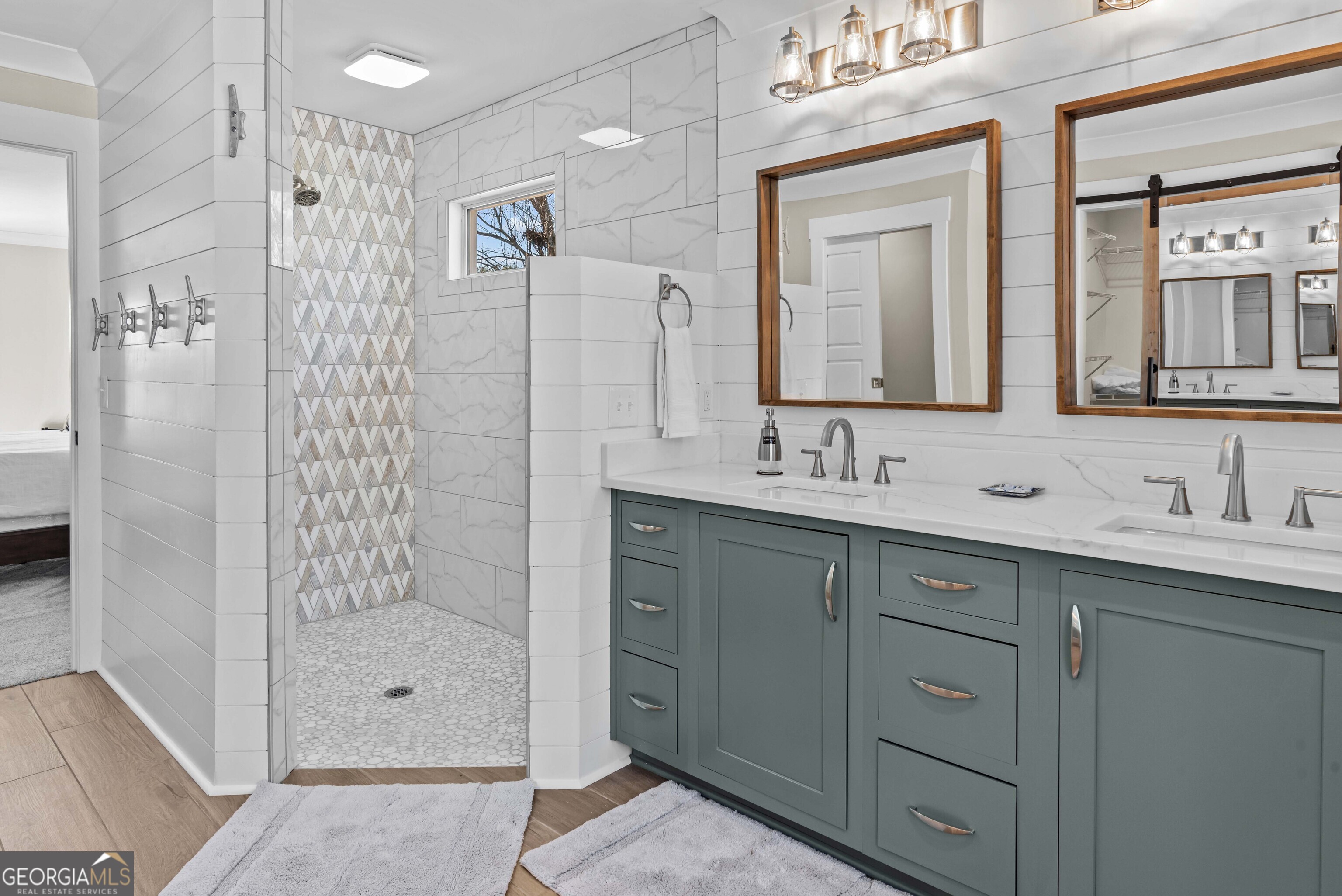 766 South Steel Bridge Road Eatonton, GA 31024 - Photo 30 of 71 a bathroom with a shower sink and mirror