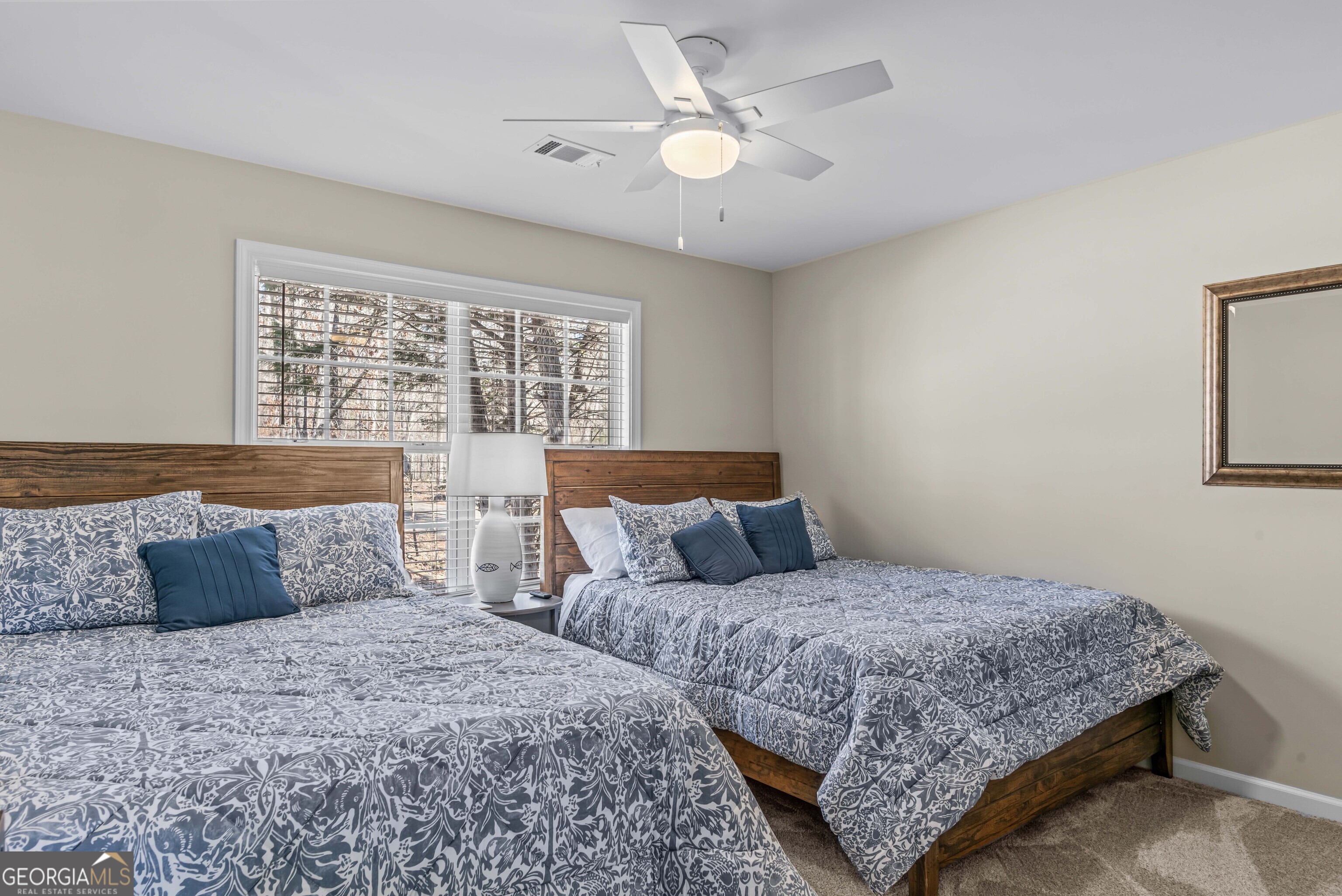 766 South Steel Bridge Road Eatonton, GA 31024 - Photo 35 of 71 a bedroom with bed and a window