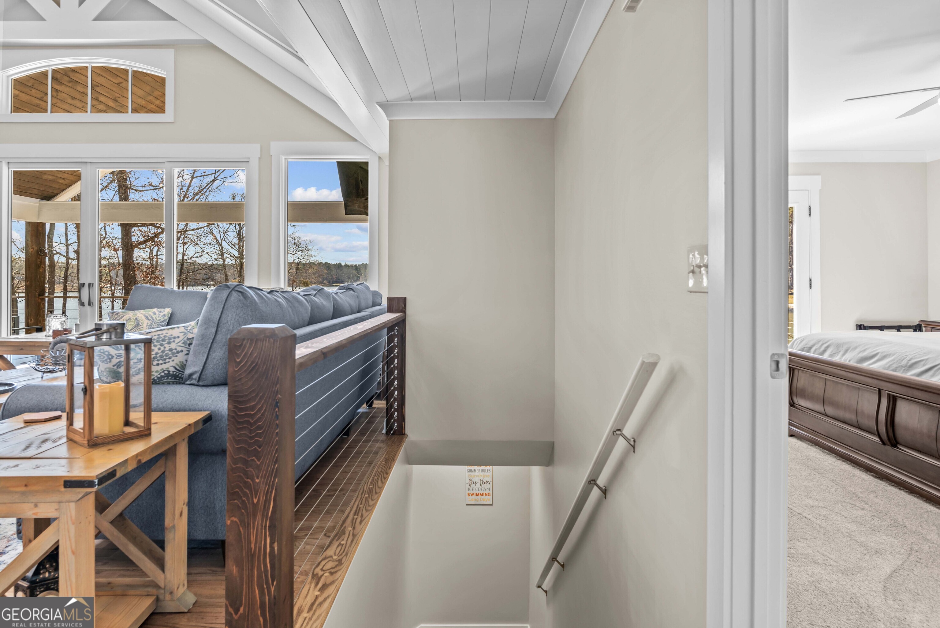 766 South Steel Bridge Road Eatonton, GA 31024 - Photo 39 of 71 a living room with furniture and a flat screen tv