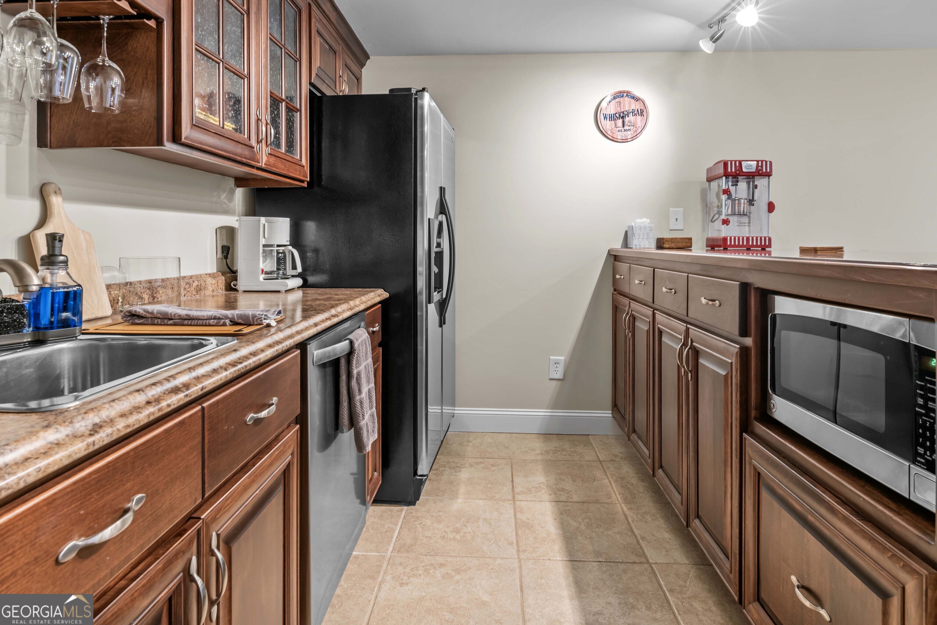 766 South Steel Bridge Road Eatonton, GA 31024 - Photo 45 of 71 a kitchen with stainless steel appliances granite countertop a sink stove and cabinets