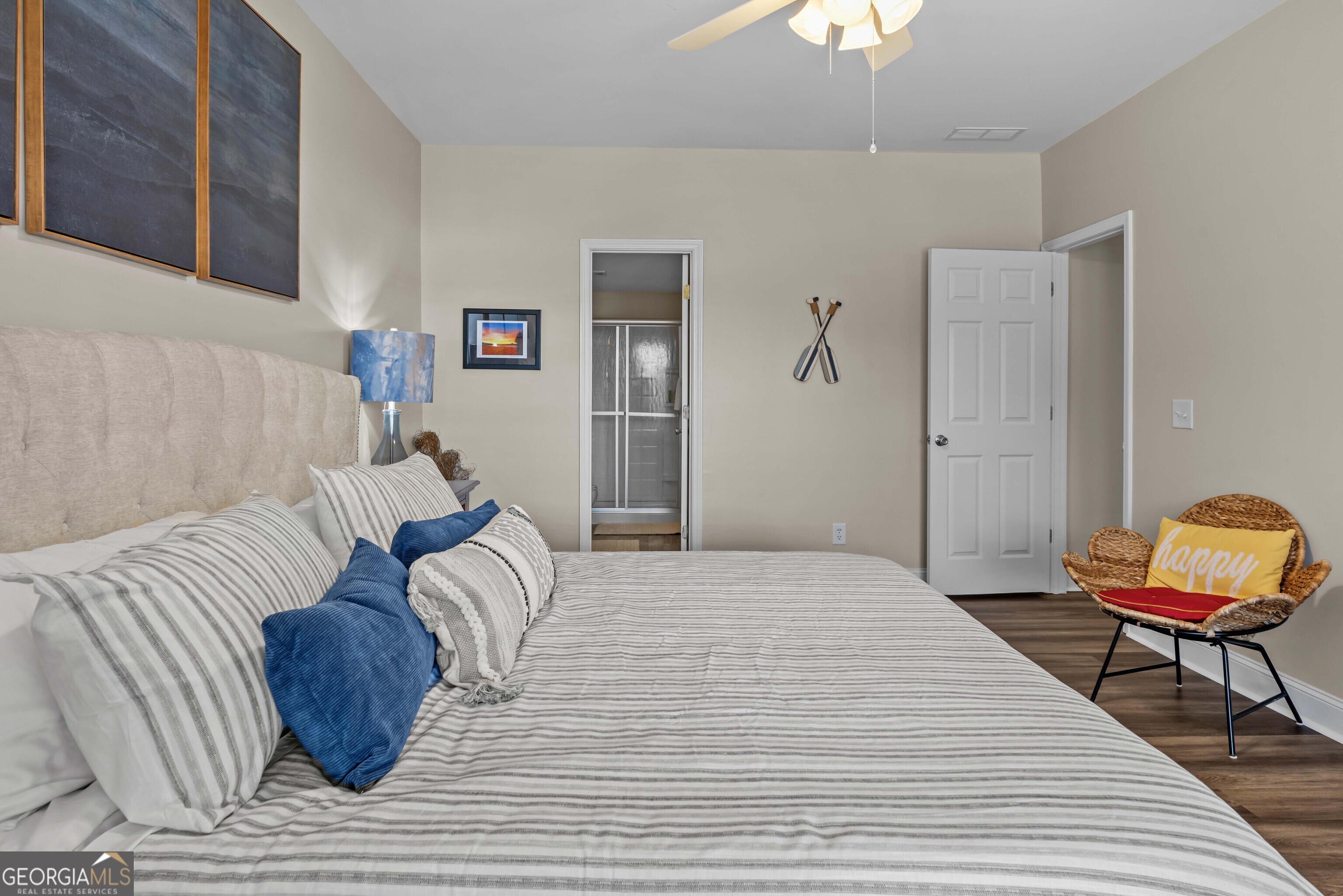 766 South Steel Bridge Road Eatonton, GA 31024 - Photo 52 of 71 a bedroom with a bed and a chair