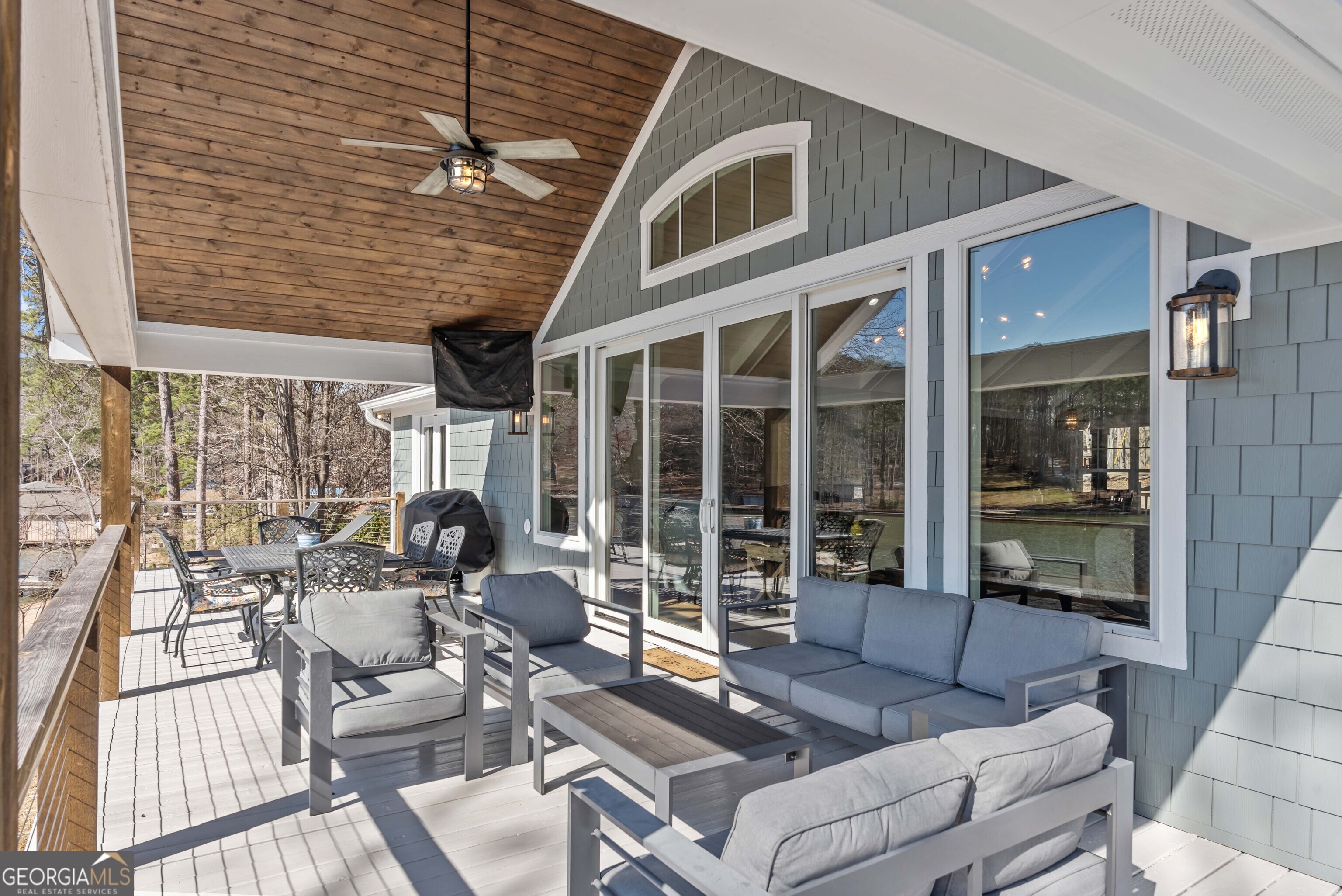 766 South Steel Bridge Road Eatonton, GA 31024 - Photo 55 of 71 a view of a patio with couches chairs and potted plants