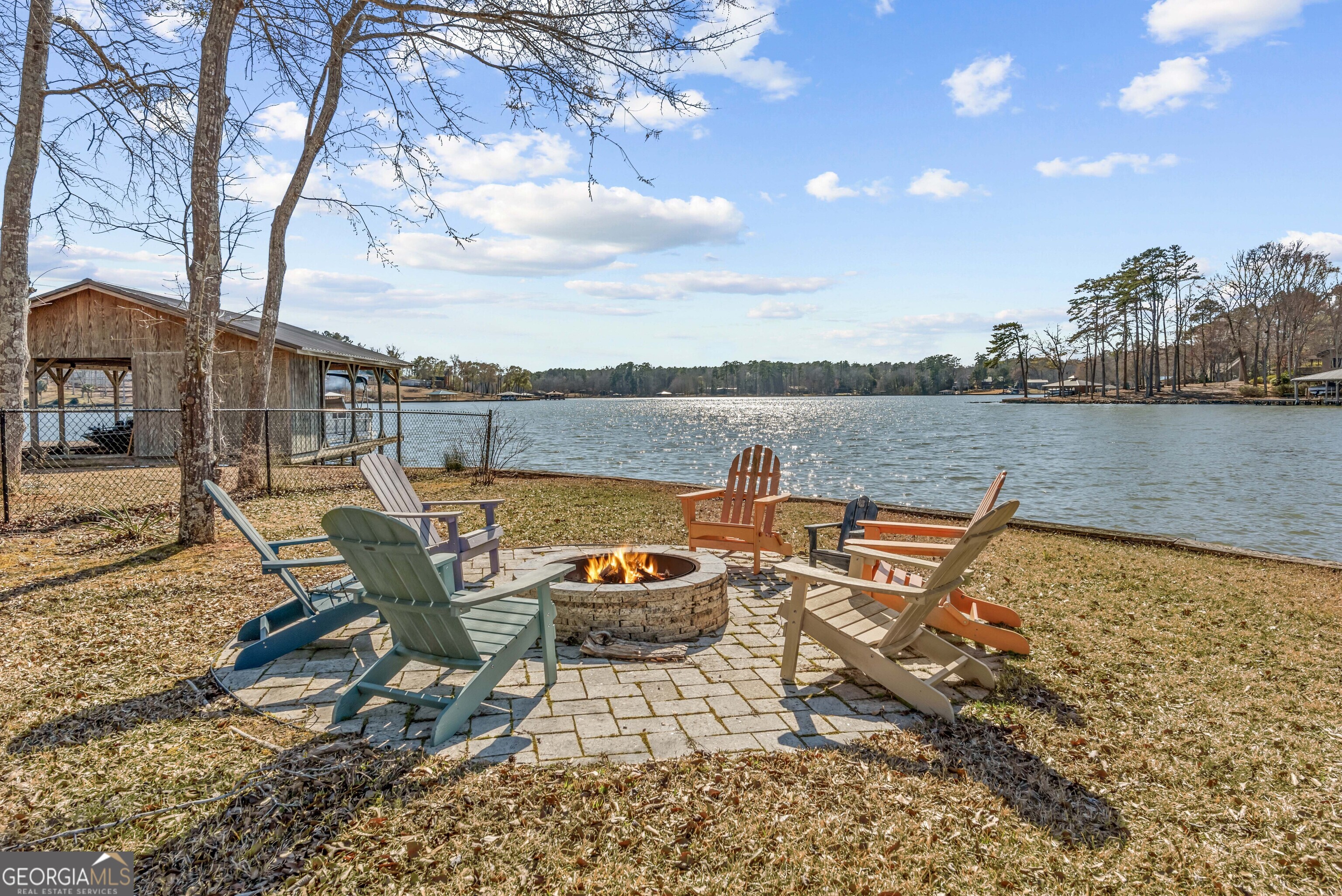 766 South Steel Bridge Road Eatonton, GA 31024 - Photo 62 of 71 a view of a lake with furniture