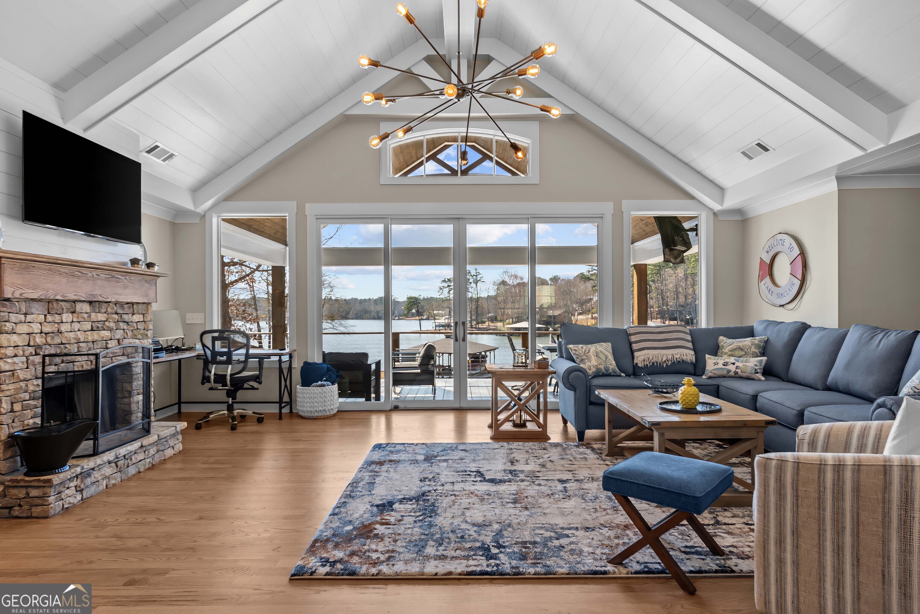 766 South Steel Bridge Road Eatonton, GA 31024 - Photo 10 of 71 a living room with furniture fireplace and flat screen tv
