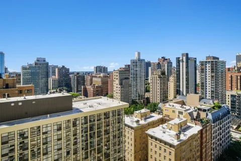 a view of city with tall buildings