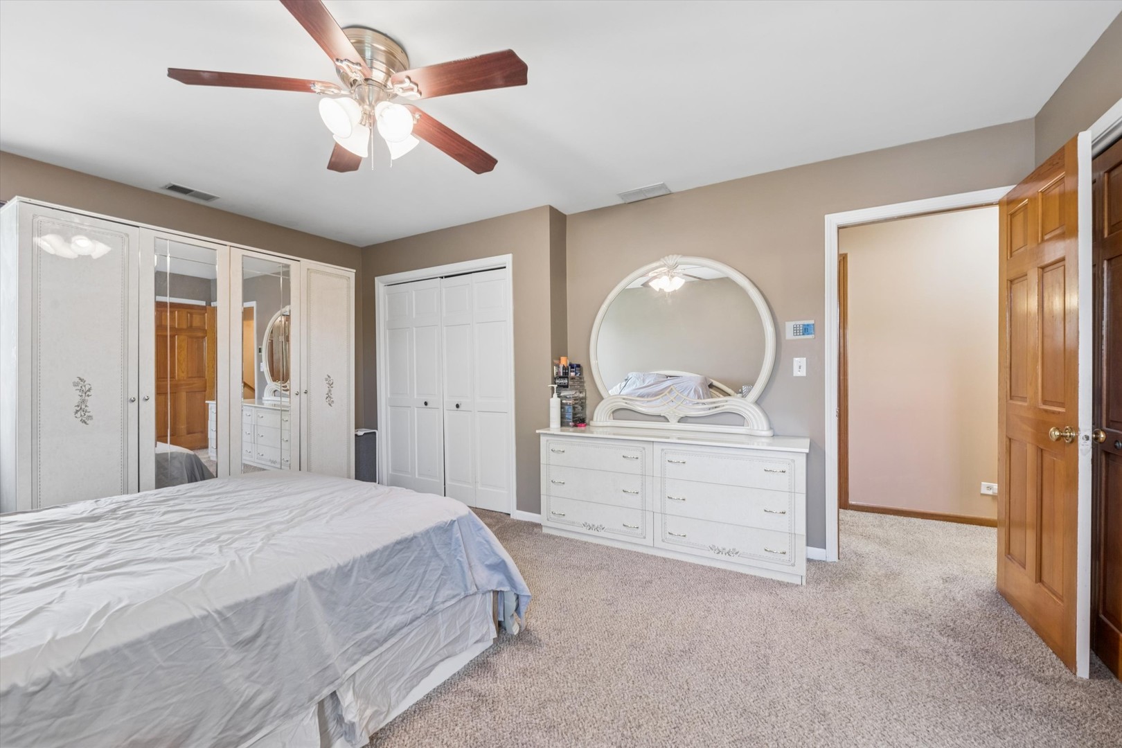 2142 North Summit Street Wheaton, IL 60187 - Photo 16 of 35 a bedroom with a bed and a dresser