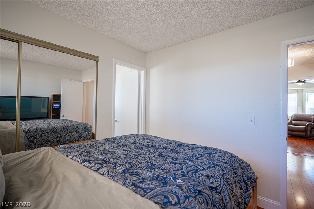 718 Rusty Spur Drive Henderson, NV 89014 - Photo 43 of 50 Comfortable bedroom retreat features ample closet space and easy access to common areas.