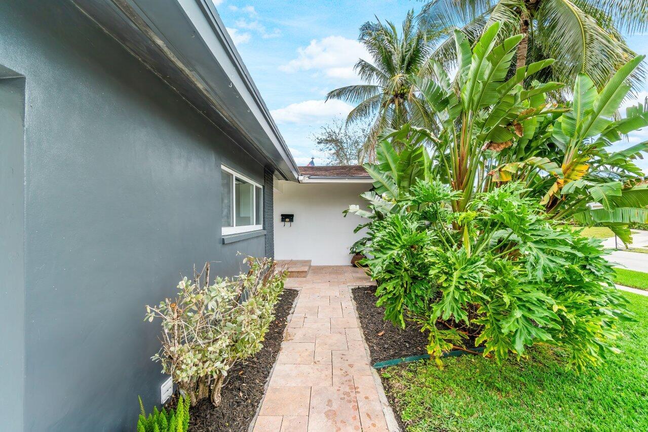 1317 Southwest 9th Street Boca Raton, FL 33486 - Photo 6 of 41 a view of a pathway with plants
