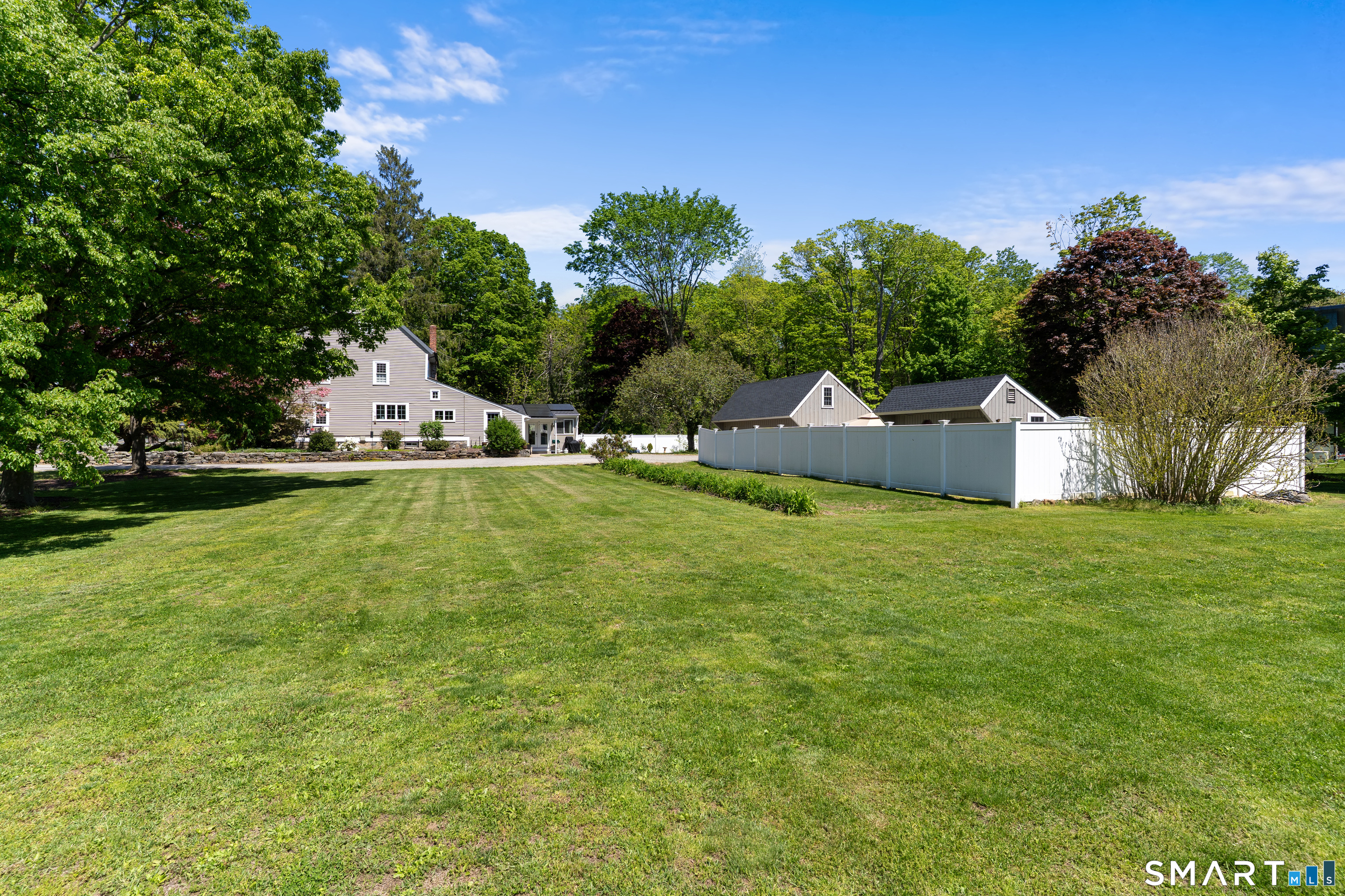 147 Boston Street Guilford, CT 06437 - Photo 2 of 38 a view of house with outdoor space and trees around