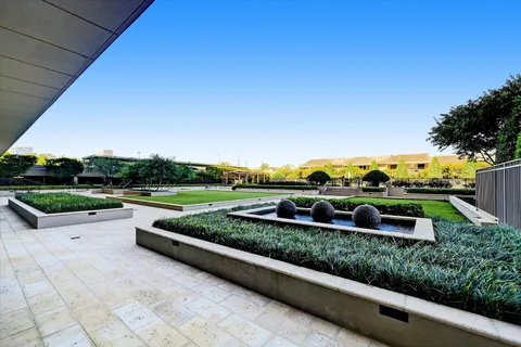 a view of a garden with houses