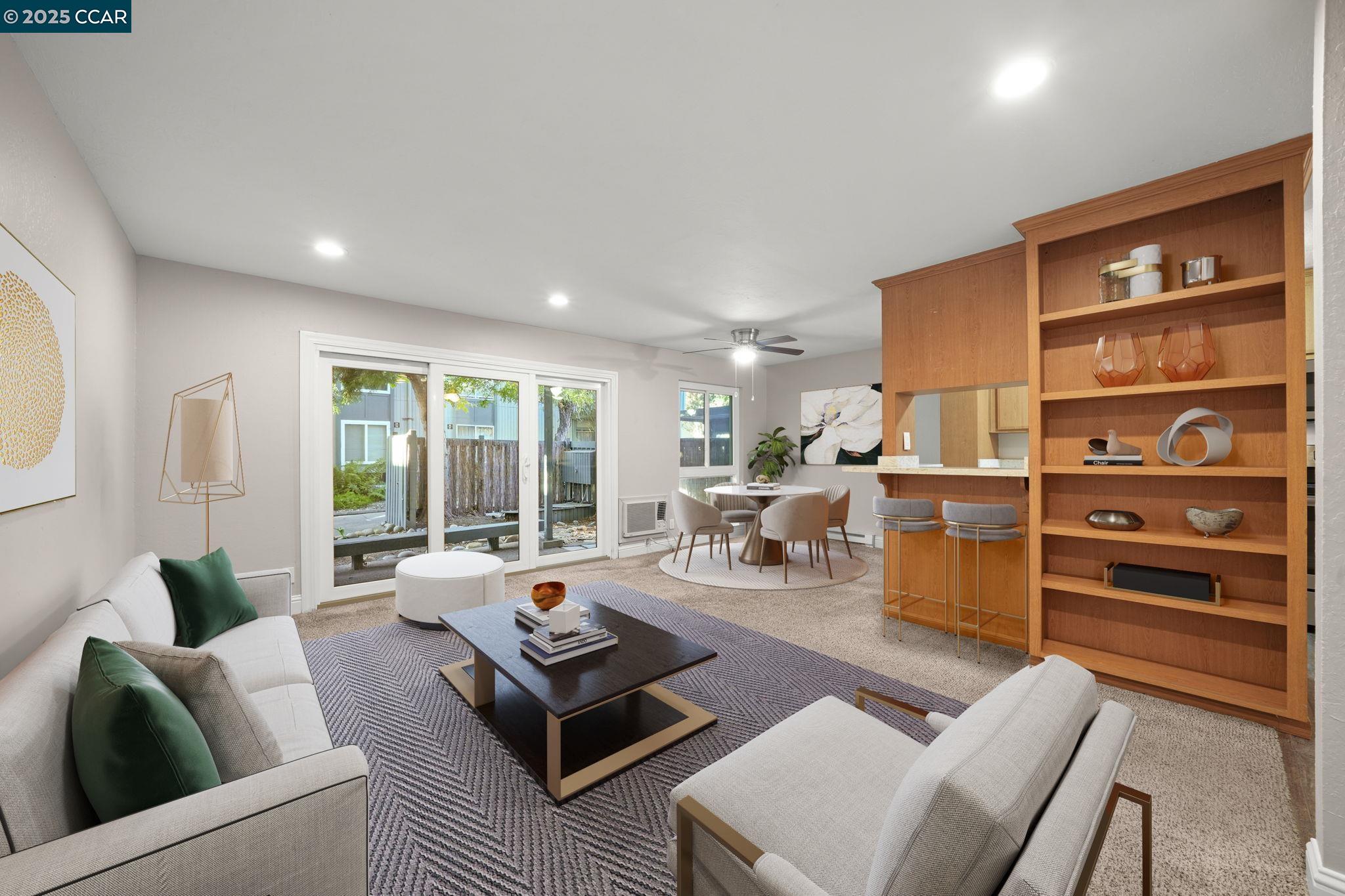 a living room with furniture and large window