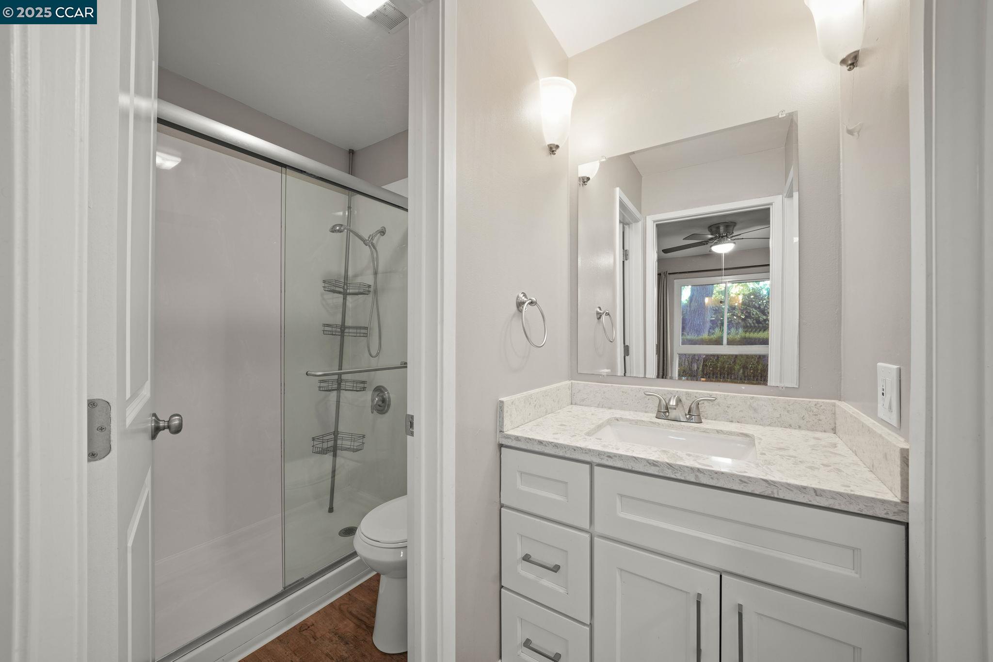 1036 Oak Grove Road, Unit 21 Concord, CA 94518 - Photo 11 of 23 a bathroom with a sink a toilet and shower