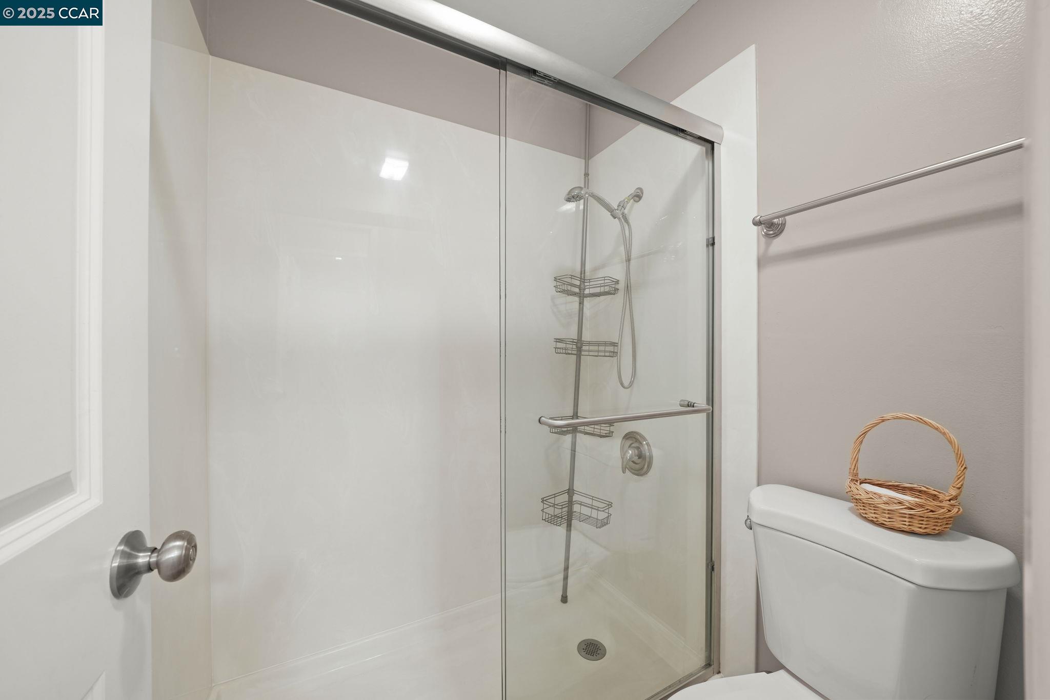 1036 Oak Grove Road, Unit 21 Concord, CA 94518 - Photo 12 of 23 a bathroom with a granite countertop bathtub shower sink and toilet
