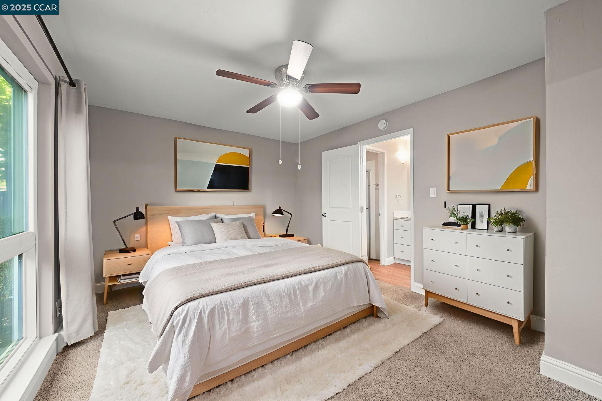 1036 Oak Grove Road, Unit 21 Concord, CA 94518 - Photo 13 of 23 a bedroom with a bed and a chandelier