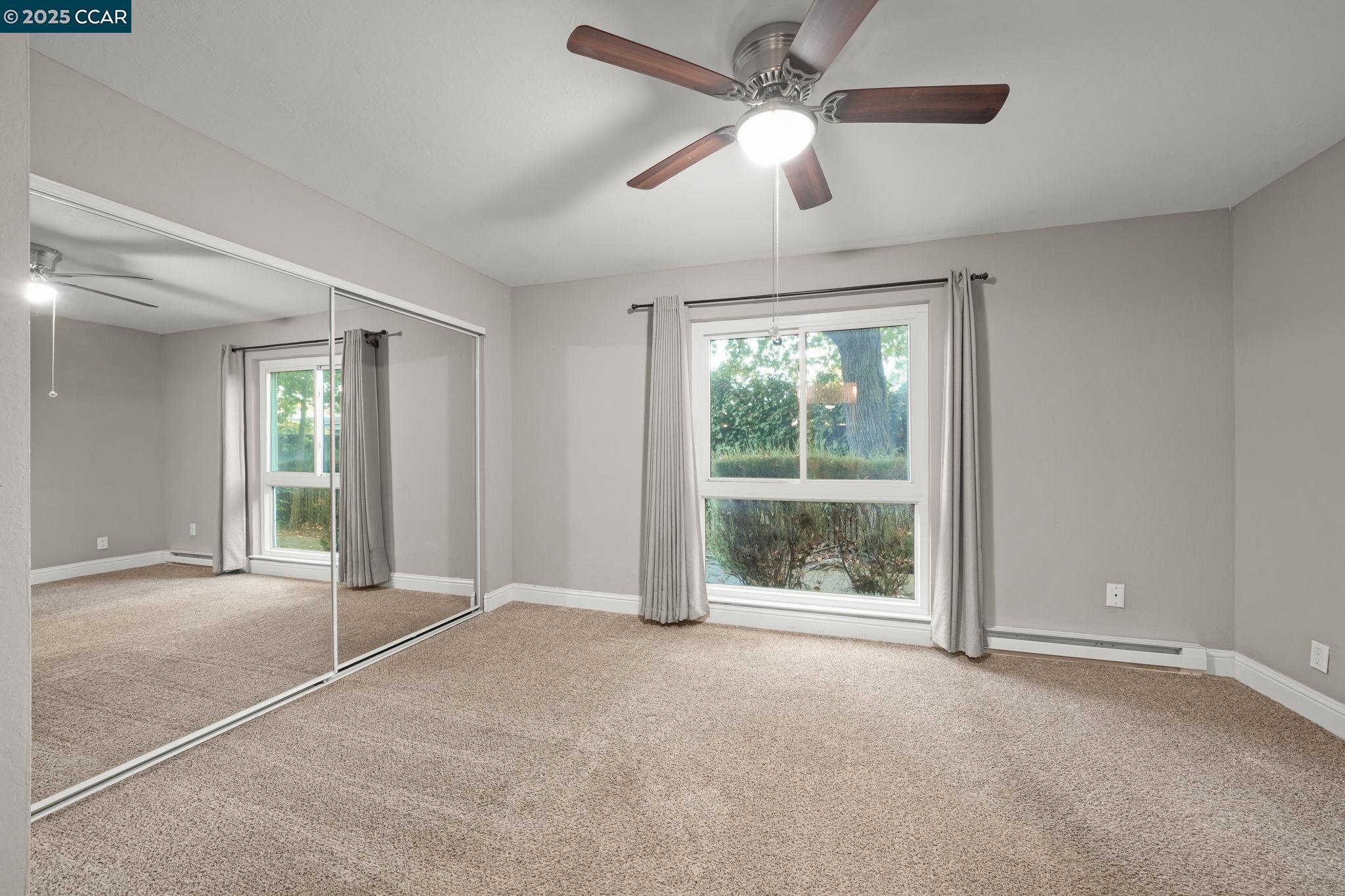 1036 Oak Grove Road, Unit 21 Concord, CA 94518 - Photo 15 of 23 a view of an empty room with a window