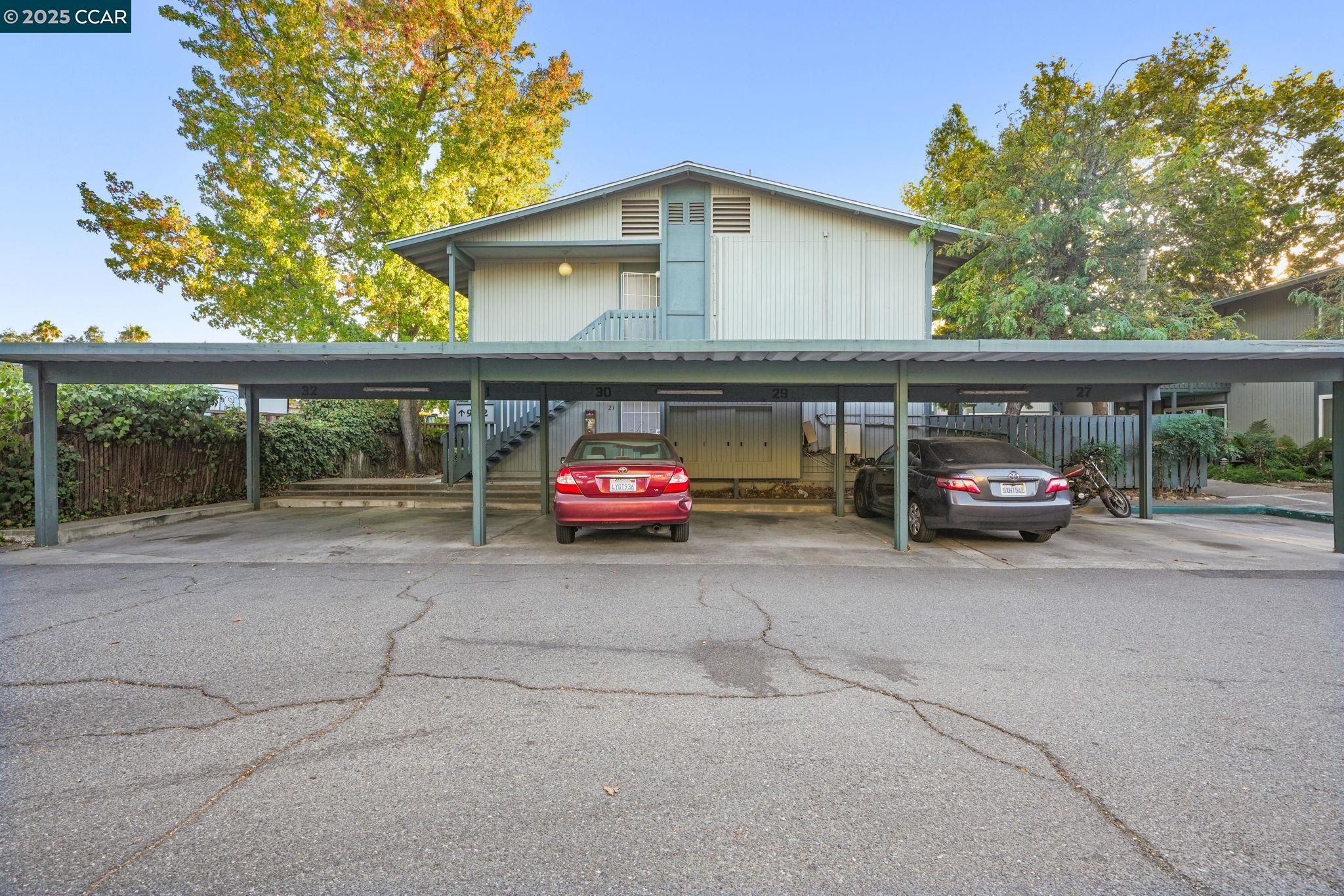 1036 Oak Grove Road, Unit 21 Concord, CA 94518 - Photo 20 of 23 a view of a car parked in front of a house
