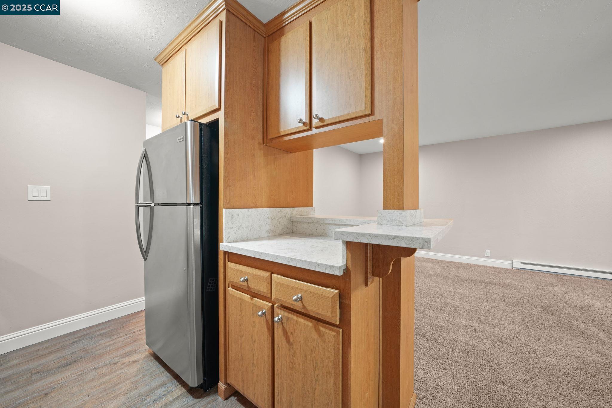 1036 Oak Grove Road, Unit 21 Concord, CA 94518 - Photo 5 of 23 a kitchen with stainless steel appliances granite countertop a refrigerator and a sink