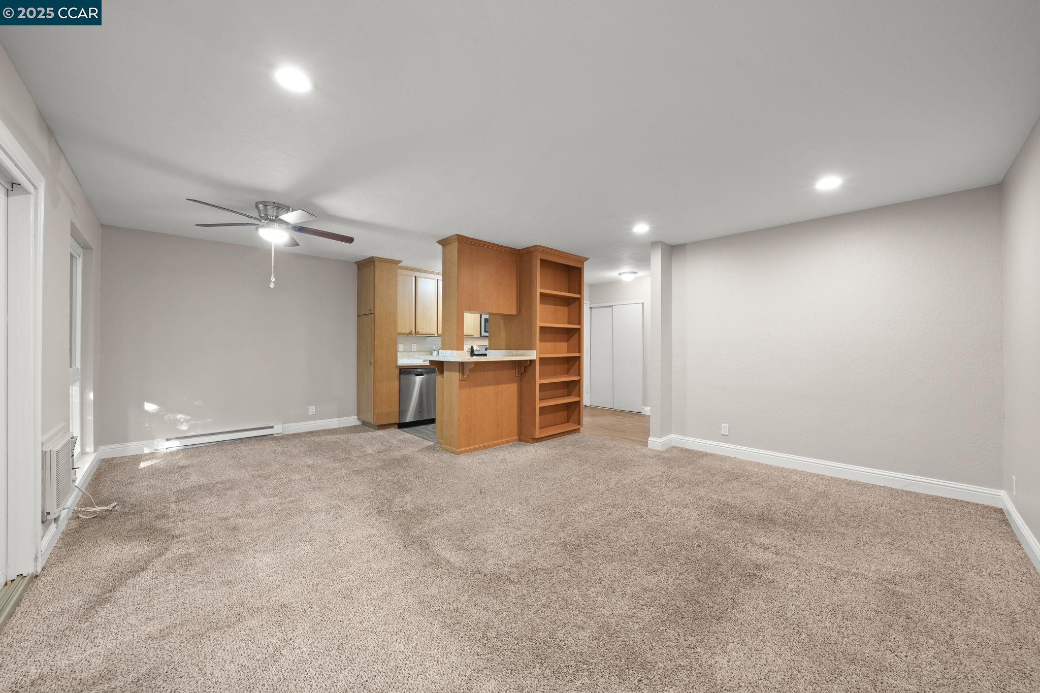 1036 Oak Grove Road, Unit 21 Concord, CA 94518 - Photo 8 of 23 a view of a kitchen with a sink and a refrigerator